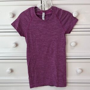 Pink and black striped Lululemon swiftly tech